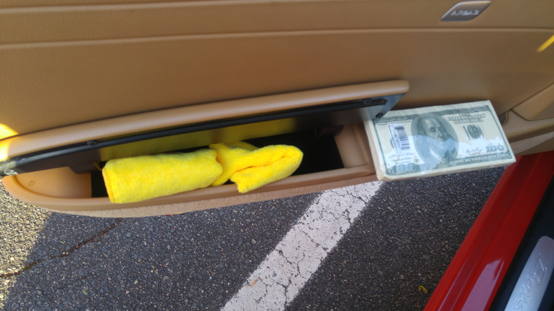 Driver door pocket. Microfiber towels and $100 tissues for being annoyingly fancy